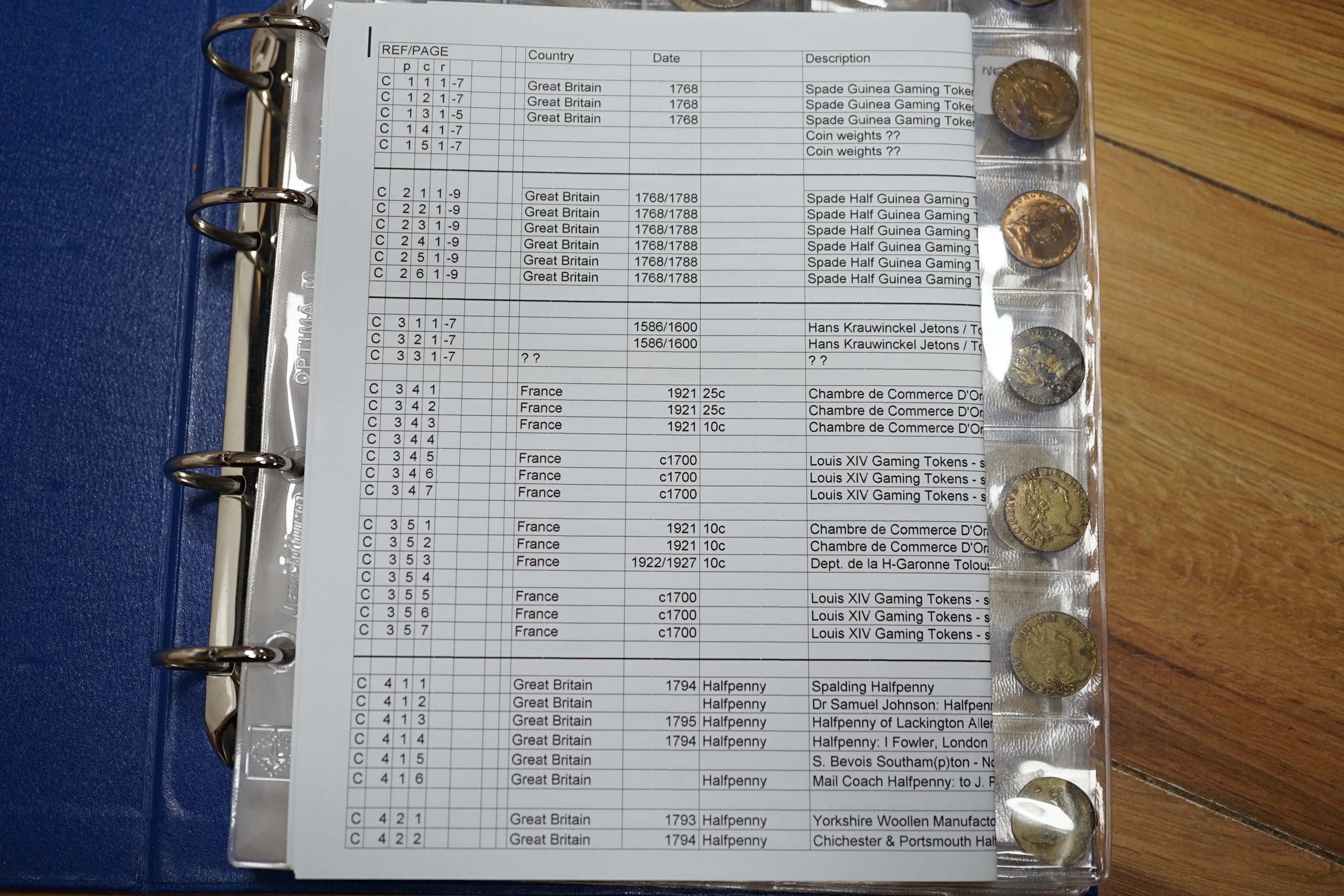 A large collection of halfpenny tokens and gaming tokens, 17th to early 20th century, in an album